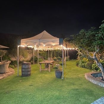 3m x 4.5m Premium gazebo linked to our hexagonal 6m x 6m with festoon lights.: Click Here To View Larger Image