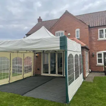 4.5m x 4.5m Mini Marquee Gazebo complete with a ground sheet and carpet flooring set up in Kirklington, Nottinghamshire for a surprise 50th birthday celebration.: Click Here To View Larger Image
